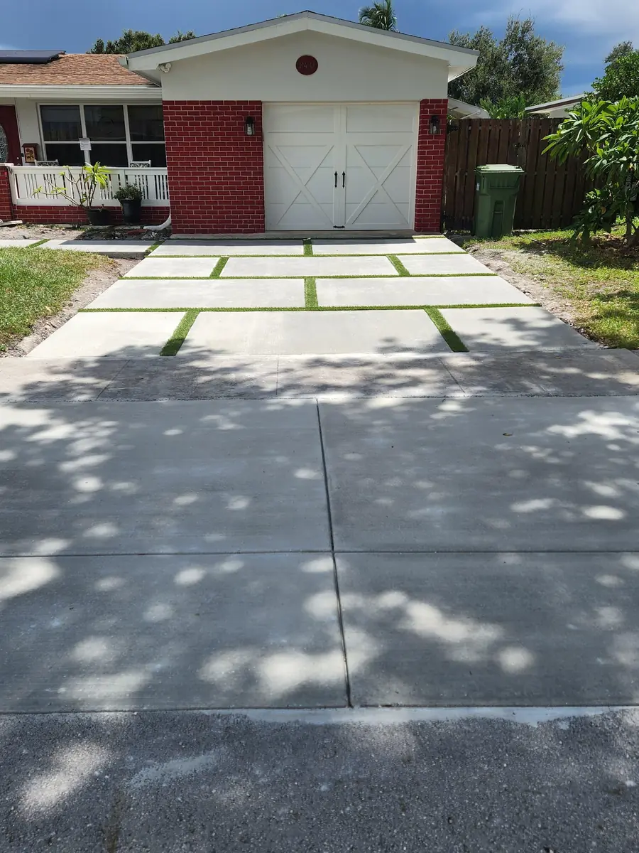 Driveway: forms to finished concrete with turf strips - after